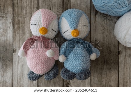 Blue and pink crochet penguins, amigurumi
