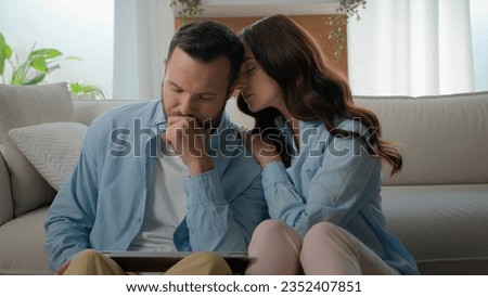 Caucasian man lost with laptop bad news receive email about work dismissal computer failure upset husband woman wife calming consoling supporting hugging lovely boyfriend couple at home family support