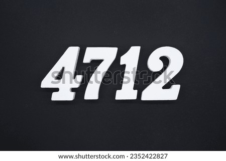 Black for the background. The number 4712 is made of white painted wood.