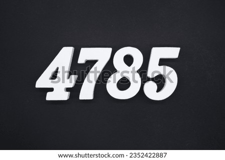 Black for the background. The number 4785 is made of white painted wood.