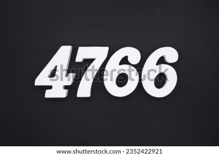 Black for the background. The number 4766 is made of white painted wood.