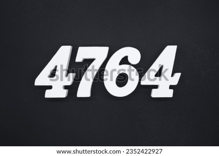 Black for the background. The number 4764 is made of white painted wood.