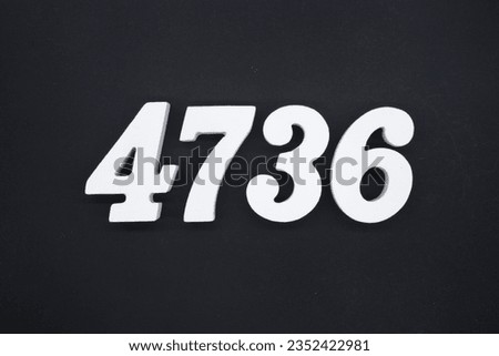 Black for the background. The number 4736 is made of white painted wood.