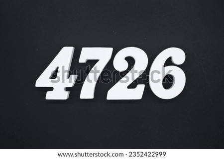 Black for the background. The number 4726 is made of white painted wood.