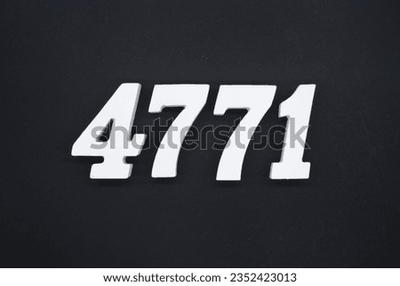 Black for the background. The number 4771 is made of white painted wood.