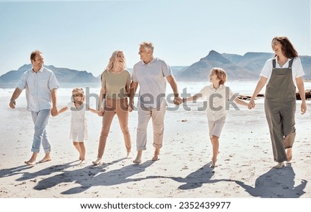 Happy, walking and big family holding hands at the beach on vacation, holiday or adventure together. Bonding, fun and children with parents and grandparents by the ocean for fresh air on weekend trip