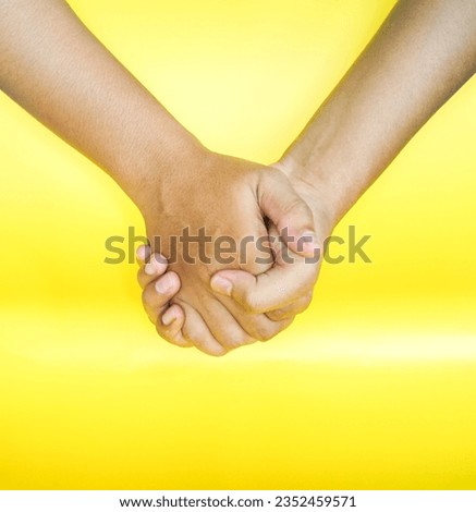 Poses of the right and left hands holding each other
