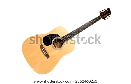 Acoustic Guitar: A standard guitar with steel or nylon strings that produces sound without electronic amplification. It's commonly used for folk, country, and singer-songwriter music. Royalty-Free Stock Photo #2352460263