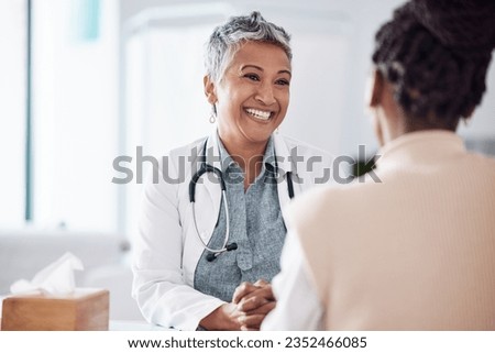 Happy, mature or doctor consulting a patient in meeting in hospital for healthcare help, feedback or support. People, medical or nurse with black woman talking or speaking of test results or advice Royalty-Free Stock Photo #2352466085