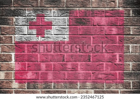 Tonga flag on a brick wall background