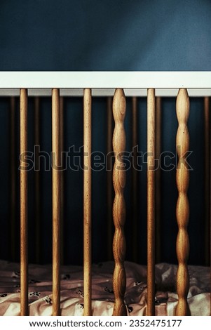 Vintage wooden decorated empty baby cot for baby Royalty-Free Stock Photo #2352475177