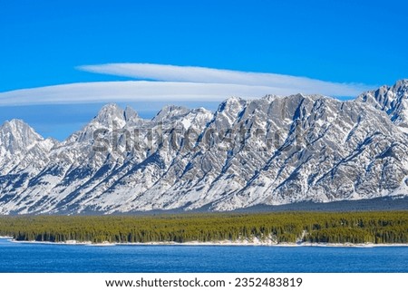 Lenticular clouds above Mt. Wintour the Opal Range mountains in Kananaskis Country, Alberta