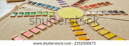 Montessori material, early education school, sun shaped, colorful, natural materials, banner Royalty-Free Stock Photo #2352500673