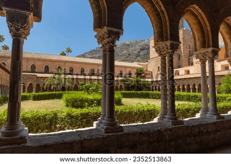 Church of Monreale, Palermo, Sicily. One of the most beautiful churches. Gold and splendor everywhere, mosaics with Christian depictions cover the walls. Norman Byzantine style. Atrium with garden. Royalty-Free Stock Photo #2352513863