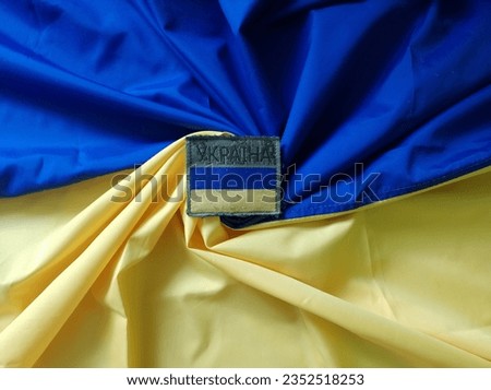 Yellow blue flag and military chevron with the flag of Ukraine. Ukrainian flag.