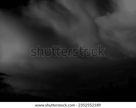 A close-up black and white portrayal of altocumulus clouds, offering a captivating backdrop for a design project with its timeless and monochromatic allure