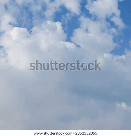 A summer day shows off an intricate dance of altocumulus clouds intertwining with thin layered elements that color the azure sky into a breathtaking sight. Close-up. Background for design project