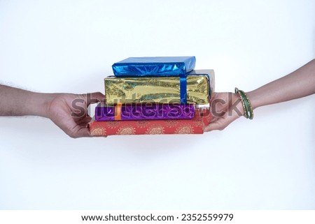 Indian Brother Giving Gifts To His Sister On Raksha Bandhan, Happy Raksha Bandhan, Siblings Exchange Gifts With White Background, The Festival Of Brother And Sister Culture Of India