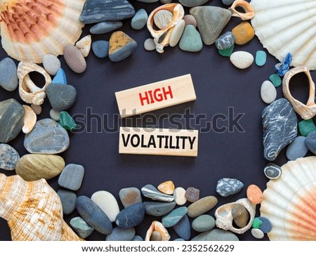 High volatility symbol. Concept words High volatility on beautiful wooden blocks. Sea shell stone. Beautiful black table black background. Business high volatility concept. Copy space.