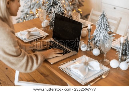 Young woman ordering Christmas gifts online