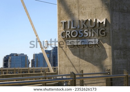 Tillicum Crossing Bridge of the People crossing the Willamette River in the downtown waterfront in Portland Oregon with cityscape in background