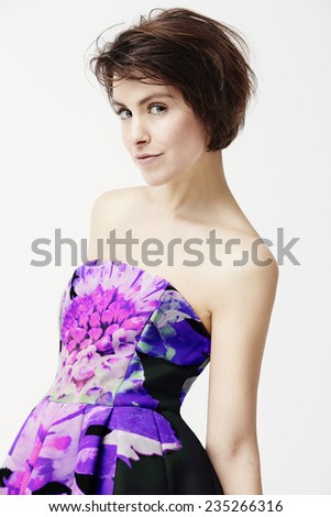 Glamorous woman in dress, studio shot 