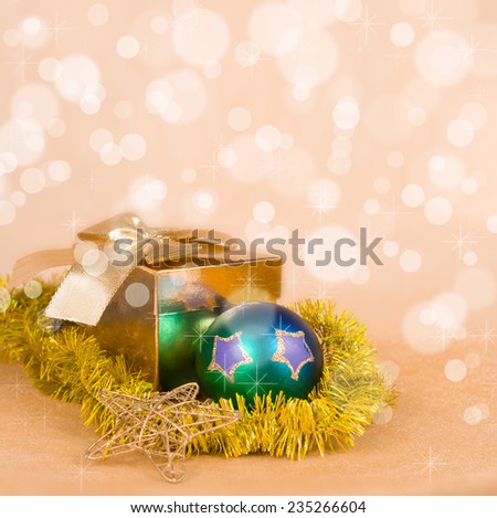 Christmas Decoration and gift box on a golden bokeh background 