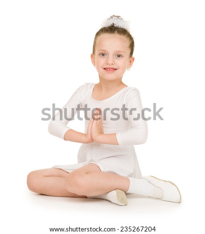 little girl dancing in a white ball gown