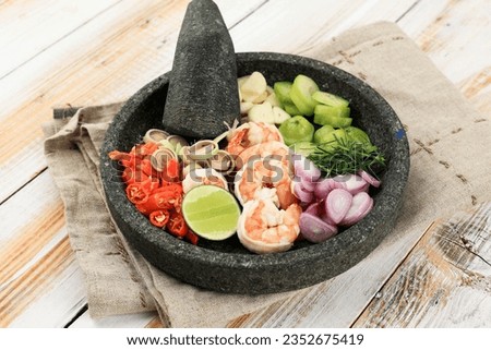 Sambal Ganja Ingredients, Sour Shrimp Sauce, Special Sauce Dish from Aceh, they call it Mariyuana Sauce Royalty-Free Stock Photo #2352675419