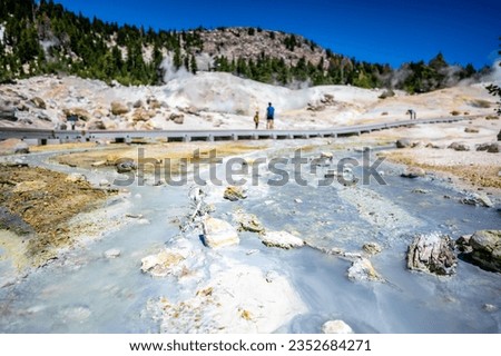 Overlook of Bumpass Hell hydrothermal area at Lassen Volcanic National Park, California, USA. Defocused boardwalk in background. Royalty-Free Stock Photo #2352684271