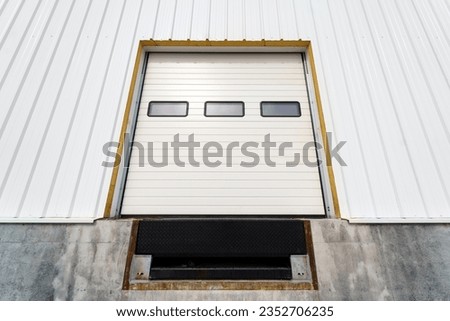 Warehouse gate for loading and unloading cargo in a distributed center Royalty-Free Stock Photo #2352706235