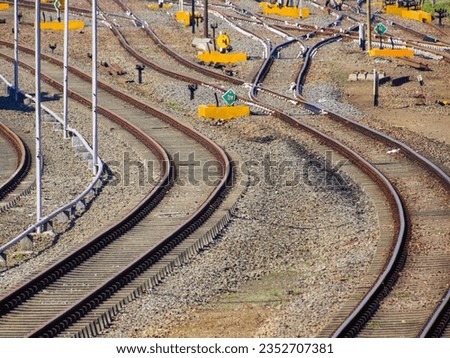 Railroad tracks on gravel ground background