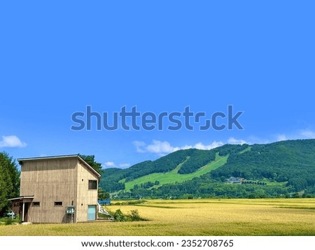 hut near mountain hill country side and blue sky Japan Royalty-Free Stock Photo #2352708765