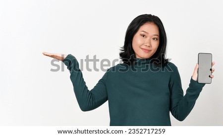 Holding Smartphone and Showing blank screen and holding on palm other hand Of Beautiful Asian Woman Isolated On White Background