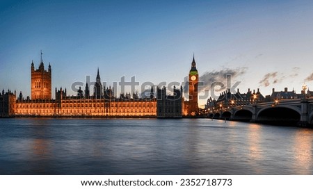 Night time at Westminster Bridge in London with Big Ben and the houses of parliament illuminated. Royalty-Free Stock Photo #2352718773