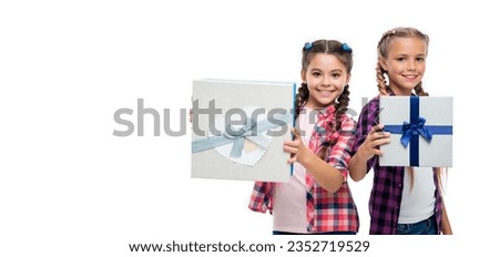present to friend. present box from shopping. children girls with boxes. happy birthday. birthday present box. children girls sharing present. copy space advertisement
