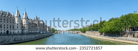 Panoramic view of Seine river with conciergerie palace and pont neuf - Ile de la Cite, Paris, France