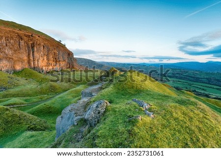 Limestone cliffs on the Llangattock Escarpment situated in the Brecon Beacons just south of the Usk Valley and overlooking Crickhowell Royalty-Free Stock Photo #2352731061