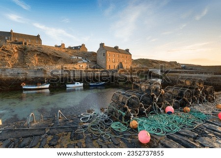 Lobster pots in the harbour at Keiss near Wick in Caithness on the north east coast of Scotland Royalty-Free Stock Photo #2352737855
