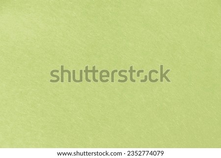 Texture of the surface of pale yellowish green paper Royalty-Free Stock Photo #2352774079