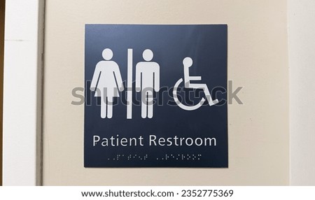 Restroom sign with male and female symbols. Symbolizes gender identity, inclusivity, equality, and social discussions