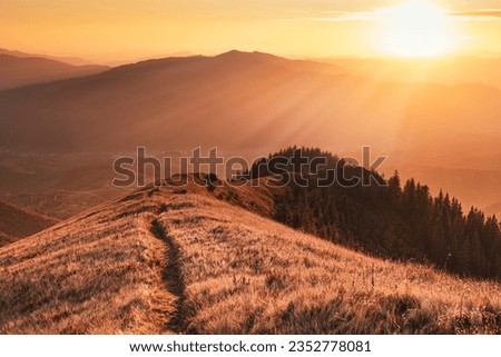 Beautiful mountain trail at the sunset in warm evening colors. Scenic outdoor landscape Royalty-Free Stock Photo #2352778081