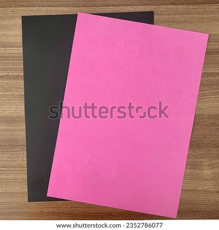 photo of pink and black background papers