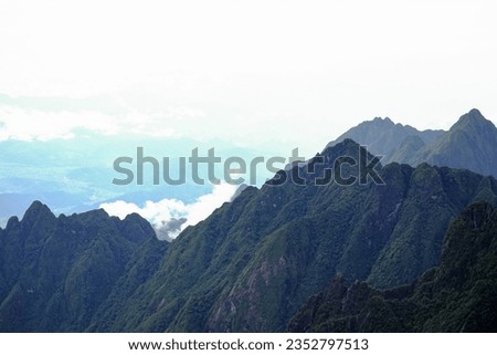 Beautiful gradient mountains with light clouds