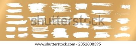 Vector hand drawn scratches for lottery scratch and win tickets design. Various shapes grungy casino gambling card elements. White brush stroke scribble textures isolated on shiny golden background Royalty-Free Stock Photo #2352808395