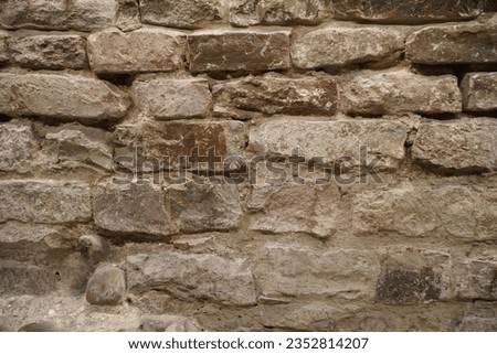 Italian historic site bricks.
Brick grunge wall background.
Old wall with stained aged bricks.