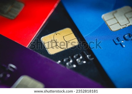 Stacked credit cards with chip, close up view with selective focus for background Royalty-Free Stock Photo #2352818181