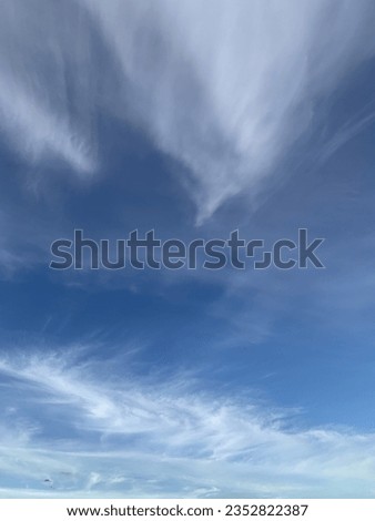 A photo of a blue sky with clouds for background