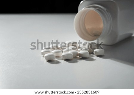 Tablet supplement on white background
