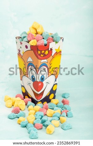 Sweets, beautiful colorful candies and accessories positioned on light surface, selective focus.